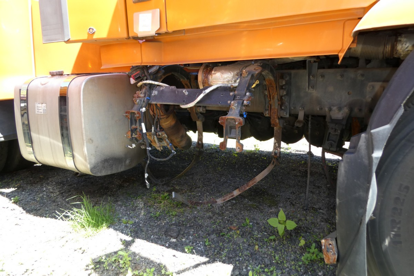 Volvo VNR64T300 truck undercarriage showing fuel tanks, exhaust and chassis components in a side view.
