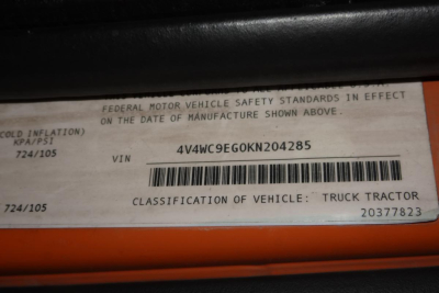 VIN plate showing VIN 4V4WC9EG0KN204285 with Federal Motor Vehicle Safety Standards notice and classification text.