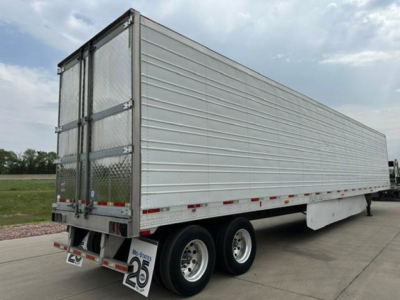 Trailer side view showing 53ft refrigerated box, dual rear doors, aluminum siding, tandem axle wheels, and bumper with safety lights.