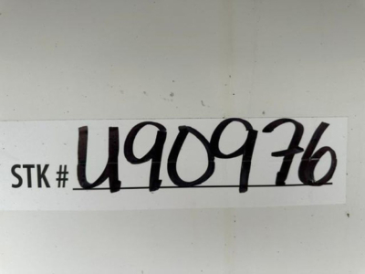 STK # U909716 sticker on a white surface