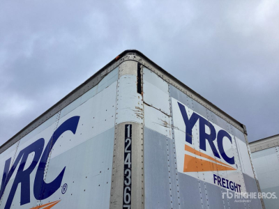 Trailer side with YRC Freight branding and vertical identifying numbers on corner of trailer.