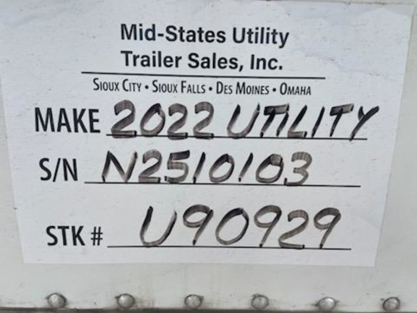 Label on trailer reading Mid-State Utility Trailer Sales, Make 2022 UTILITY, S/N N2510103, STK # U90929.