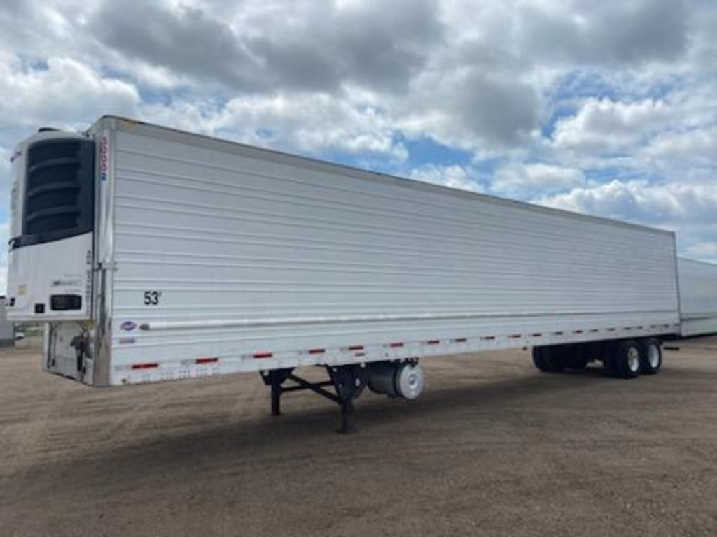 Trailer showing a 53' refrigerated trailer with a front cooling unit and tubular sides. Side text not legible.