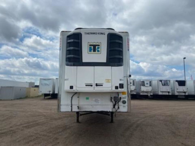 Front view of a Thermo King refrigerated trailer unit mounted at the nose of a 2022 Utility reefer trailer showing Thermo King label and white body.