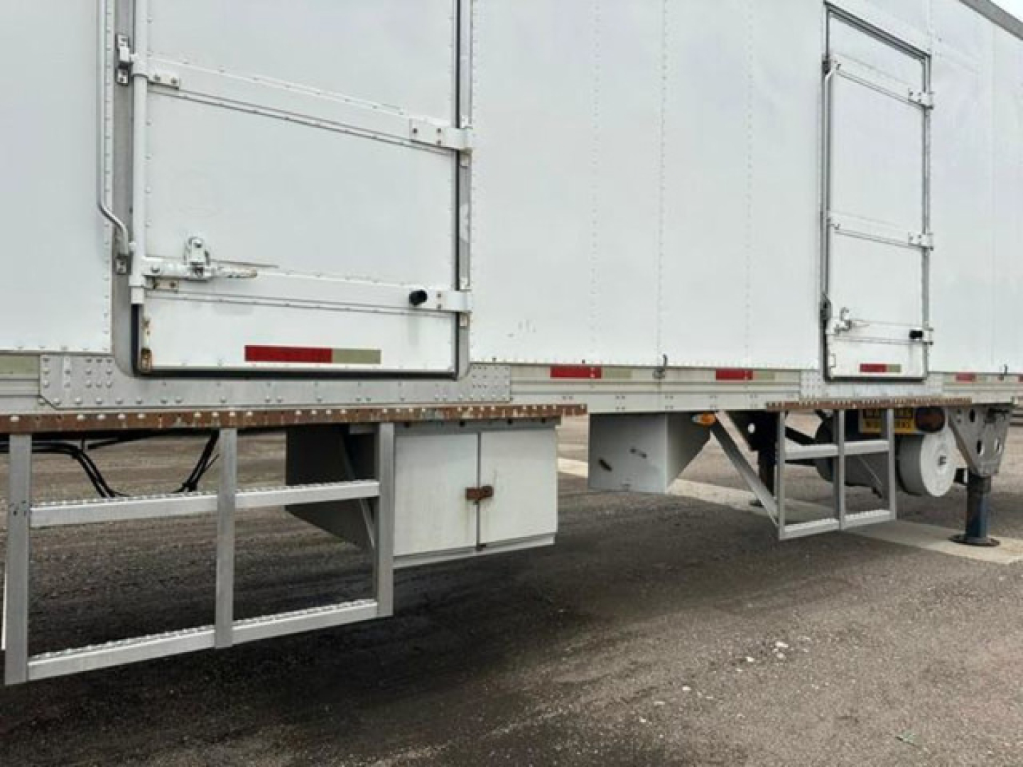 Rear/side view of a 2005 refrigerated utility trailer showing understructure and support frame.