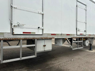 Rear/side view of a 2005 refrigerated utility trailer showing understructure and support frame.