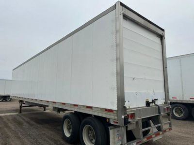 Trailer side and rear view showing 2005 utility reefer trailer with white panels and dual rear doors.