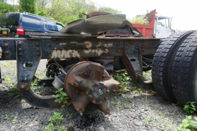 Mack R600 truck frame with rear axles and drivetrain components exposed.