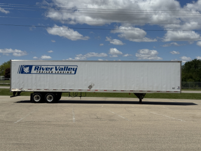 Flat side view of a River Valley Trailers leasing 53' box trailer with logo on white exterior under a blue sky.