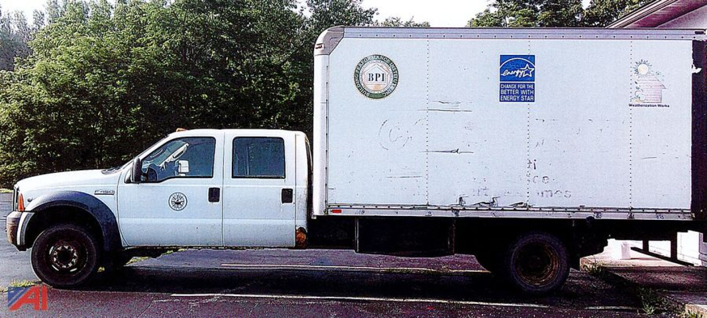 Ford F-450 Super Duty crew cab box truck in service showing cargo box and white cab.