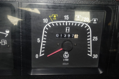 Dashboard gauge showing speedometer-like dial with odometer reading 013987 and gauge ticks from 0 to 30; small icons at top including fuel and warning icons.