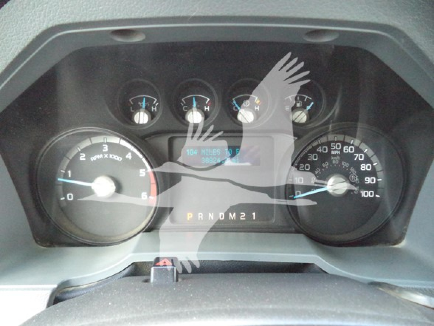 Dashboard view of a 2017 Ford F650 showing gauges and PRNDM21 gear selector.