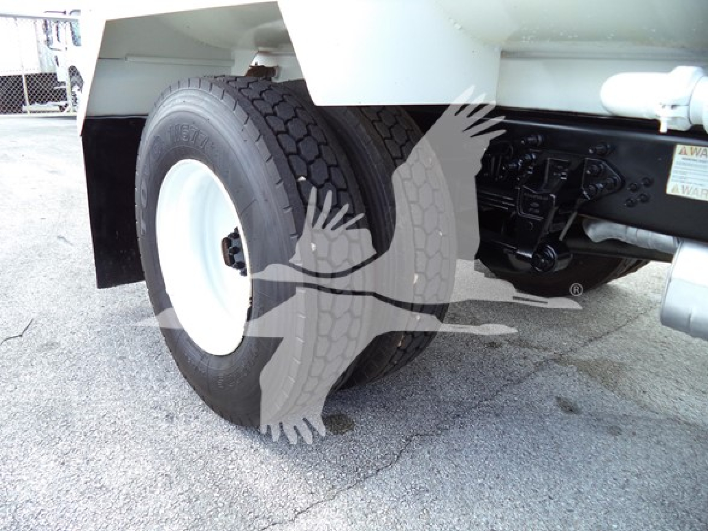 Ford F650 rear wheel and suspension View showing dual rear tires and undercarriage components.