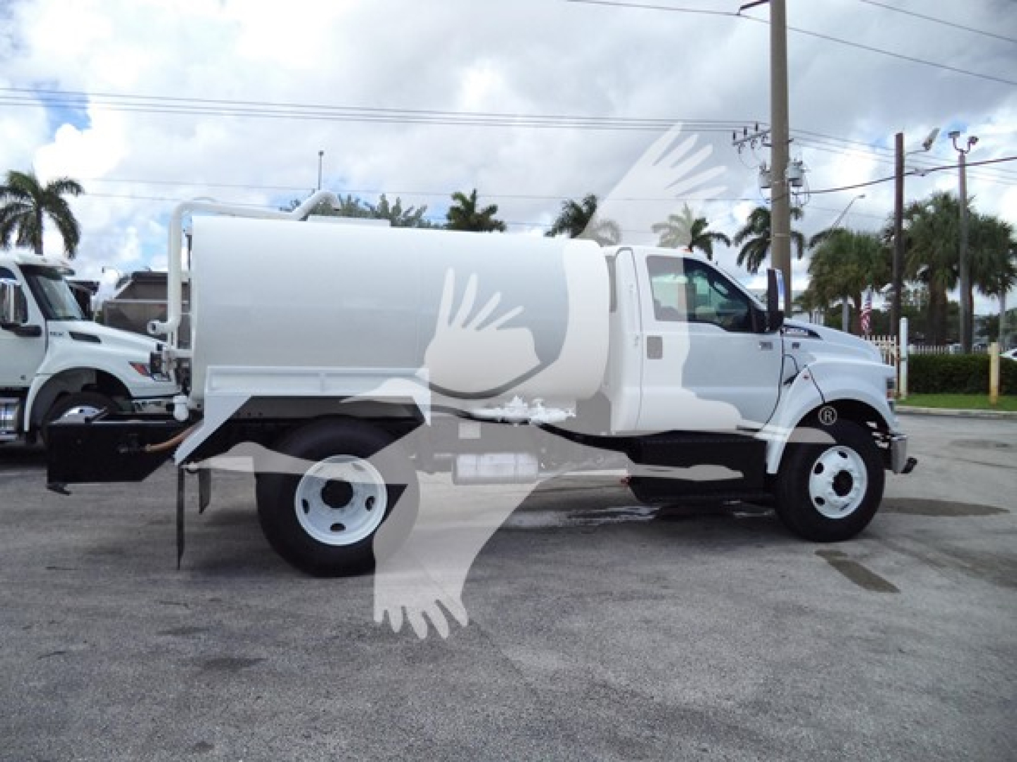 Ford F650 truck in profile view showing large aluminum service body and front cab