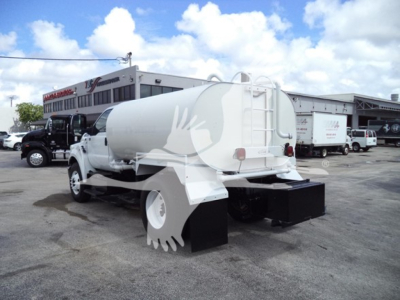 2017 Ford F650 concrete water tanker truck rear view with large rear mud flaps and tank, showing tail area and back bumper.
