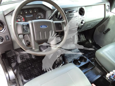 Ford F-Series dash and steering wheel interior showing gauges and center console.