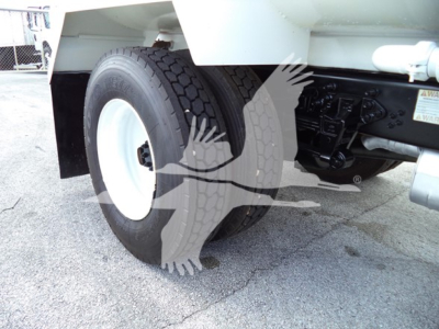 Ford F650 rear wheel and suspension View showing dual rear tires and undercarriage components.