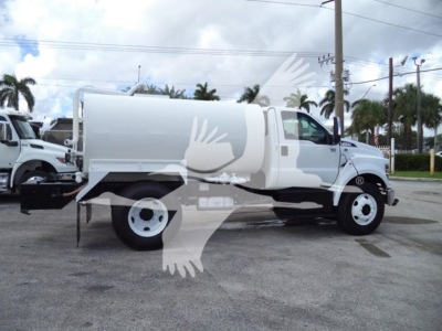 Ford F650 truck in profile view showing large aluminum service body and front cab