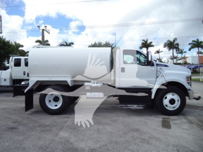 Ford F650 water truck side view showing large tank and dual rear wheels