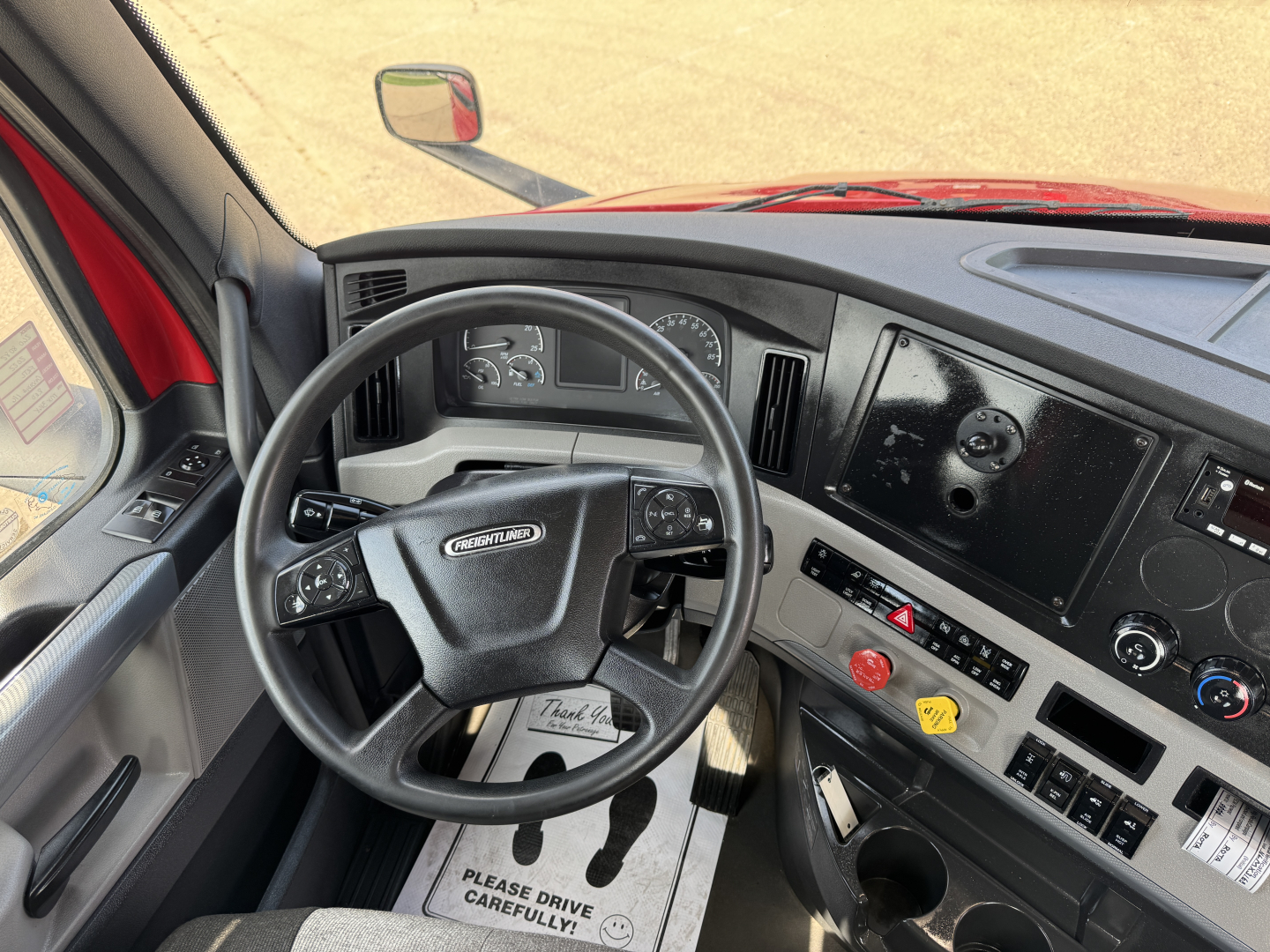 Freightliner Cascadia 116 dashboard and steering wheel view with instrument cluster and controls.