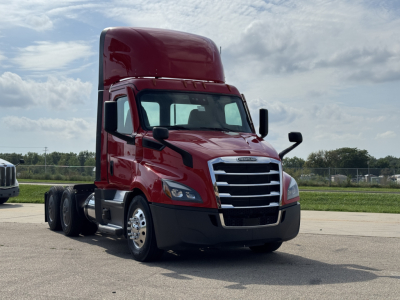 Freightliner Cascadia 116 day cab truck in red, front view with sleeper cab, chrome grille, and dual rear axles.