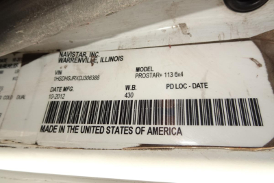 Label on vehicle showing NAVISTAR INC. WARRENVILLE, ILLINOIS VIN 1HSDHSJRXDJ306388 MODEL PROSTAR+ 113 6x4 DATE MFG 10-2012 MADE IN THE UNITED STATES OF AMERICA