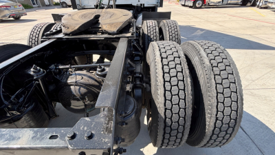 Kenworth T680 chassis and dual rear axles view showing dual tires and frame detailing.