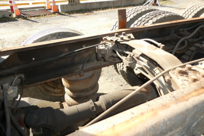 Mack RD688S dump truck chassis view showing rear suspension and drivetrain components.