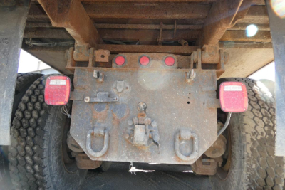 Rearm of Mack RD688S dump truck showing hitch plate, taillights, and mounting hardware.