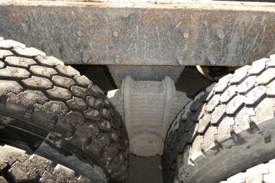 Mack RD688S dump truck undercarriage showing tandem rear axles and differential housing
