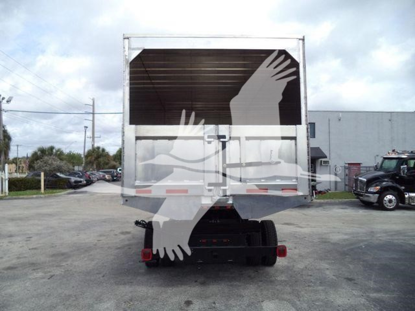 Truck rear view showing cargo bed and gate of 2023 Chevrolet Silverado 6500HD chassis in-service with stock number 16FTCHIP6500HD.