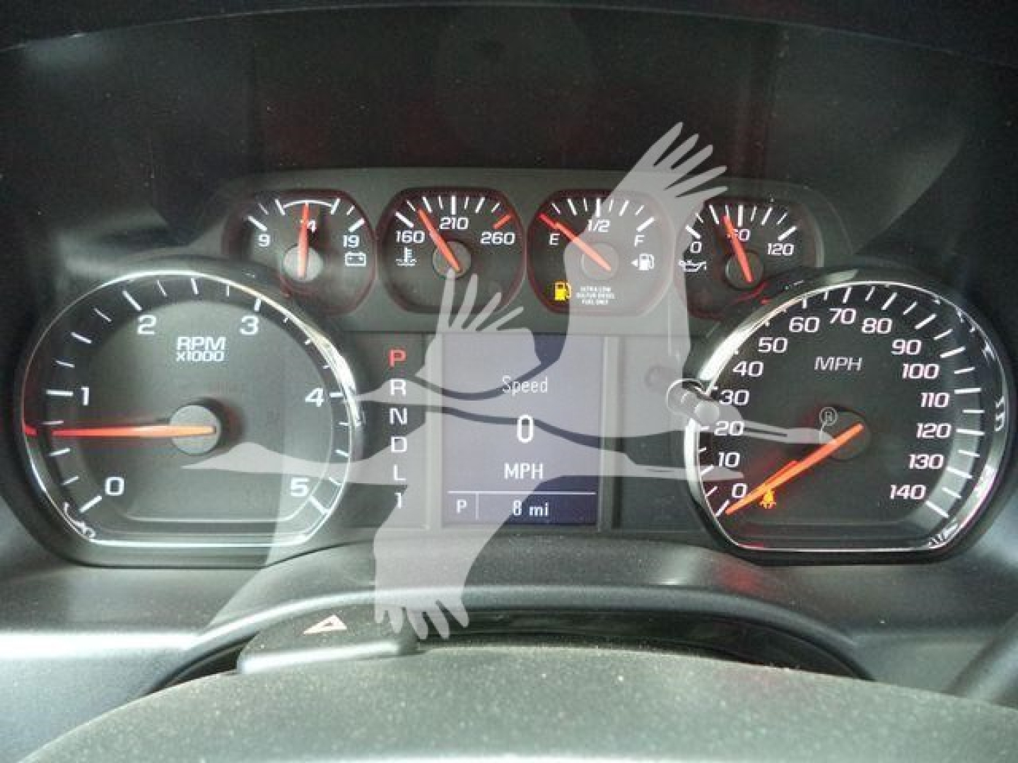 Dashboard view of a Chevrolet Silverado 6500HD instrument cluster with multiple gauges, including tachometer, speedometer, and digital display showing speed and gear indication.