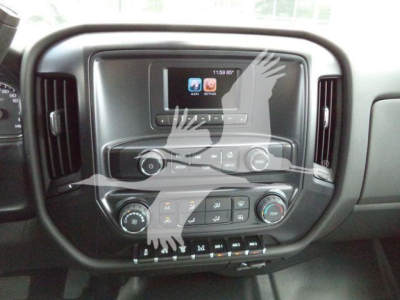 Chevrolet Silverado dashboard center console showing touchscreen display and climate controls in a new truck cabin.