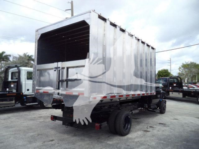 Chevrolet Silverado 6500HD dump bed truck rear view showing cargo area and dual rear wheels.