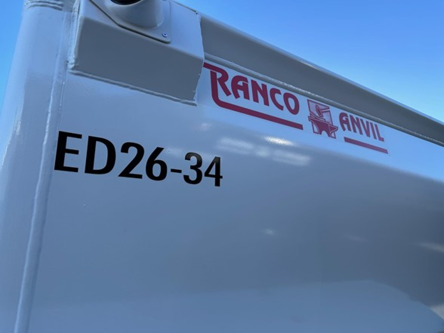ED26-34 dump trailer with Ranco Anvil logo and ED26-34 marking on white exterior.