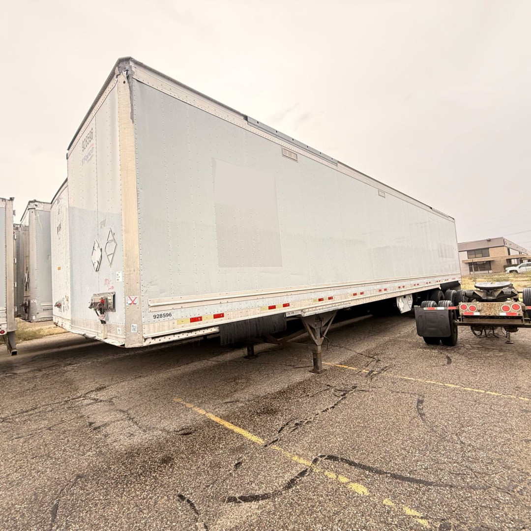 Great Dane 7441 SL dry van trailer in a parking lot, side view, with support legs deployed and tandem axles visible.