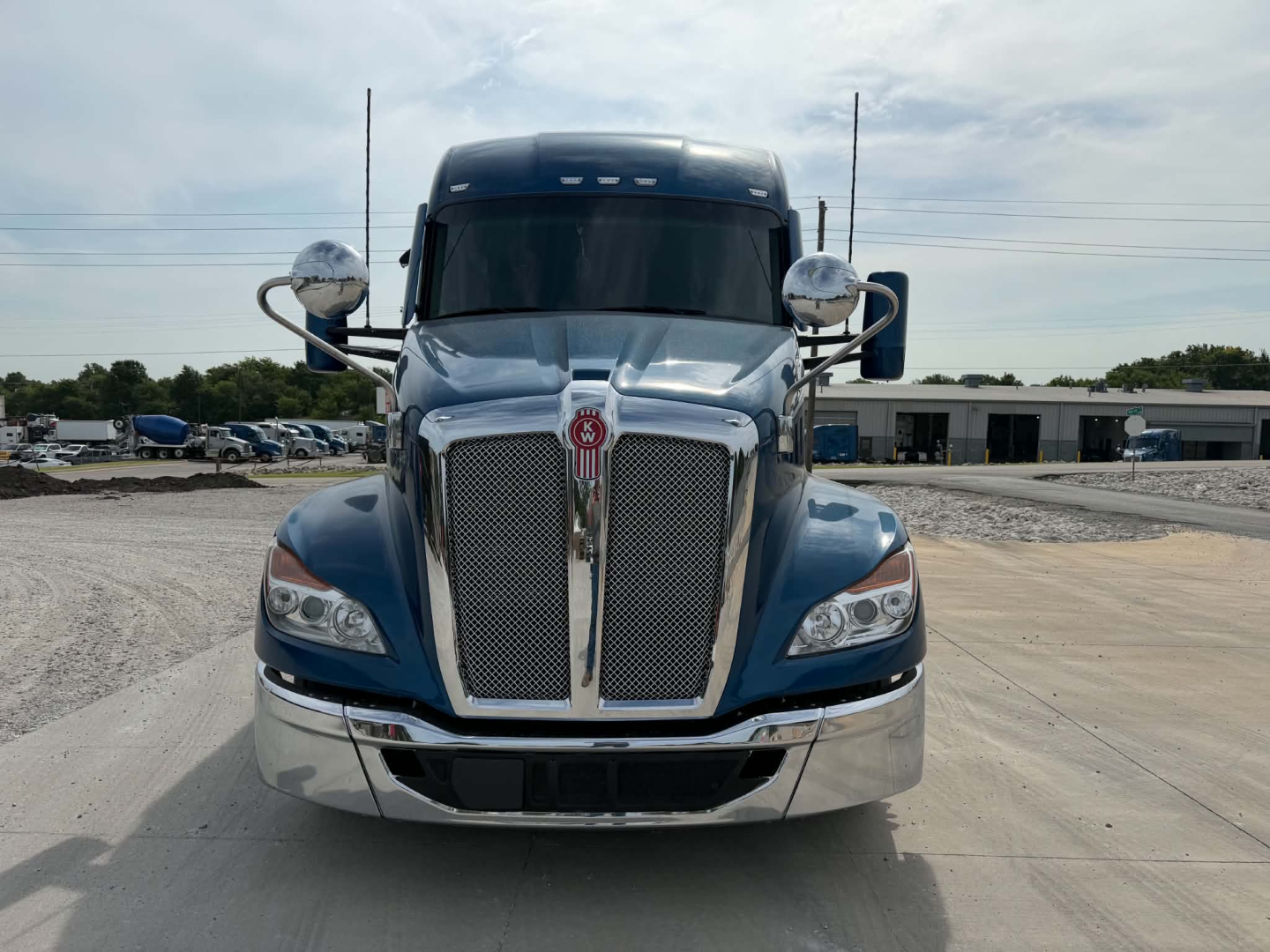 Kenworth T680 front view showing grille and bumper with chrome accents.