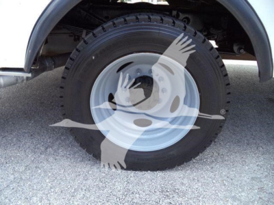 Wheel of a 2011 Ford F450 XLT service/utility truck with steel rim and tire sidewall details visible.