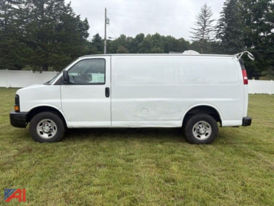 Chevrolet Express 2500 cargo van side view showing plain white cargo van with dual rear doors and standard steel wheels.