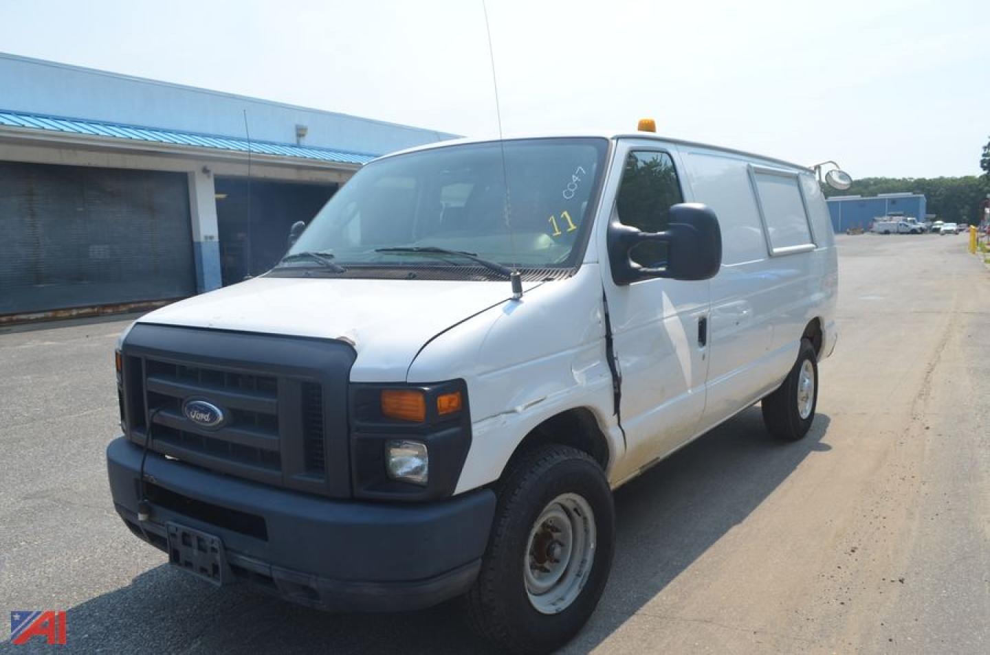 Ford E-Series van front-left view with white body, black grille, cargo van, used 2014 Ford E350.