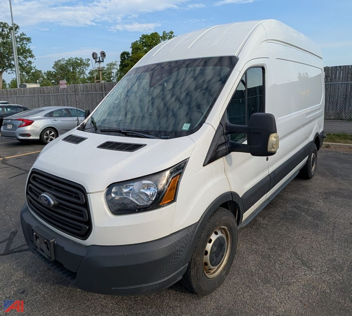 Ford Transit T250 cargo van in white, front-left view with large cargo area, no visible branding other than Ford grille.