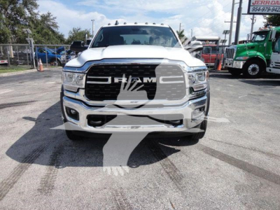 Ram 2500/5500 style pickup front view showing chrome grille with RAM emblem and headlights