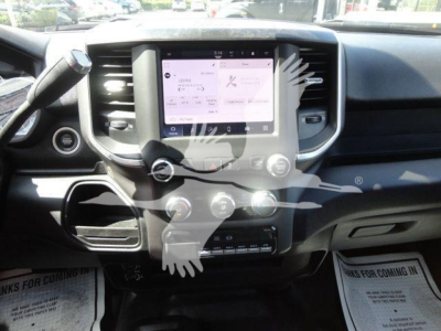 Dashboard view of a 2024 Ram 5500 SLT with a central touchscreen display, climate controls, and steering wheel visible.