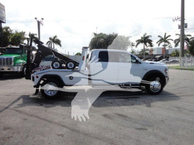 Ram 5500 SLT tow truck/flatbed with winch and tow setup, side profile view
