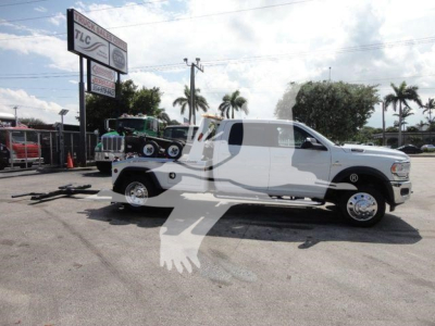2024 Ram 5500 SLT truck with winch equipment, white cab and flatbed setup, stock number J63987, category Winch, type Trucks, new.