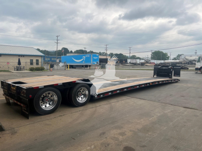 Trailer showing a long flatbed with dual rear axles and wooden deck, labeled 2025 XL Specialized Mini Deck in a used condition.