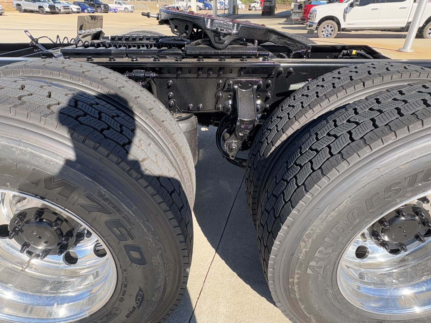 Mack PR64T truck chassis showing dual rear axles and large tires; no readable text visible on components.