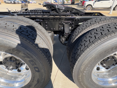 Mack PR64T truck chassis showing dual rear axles and large tires; no readable text visible on components.
