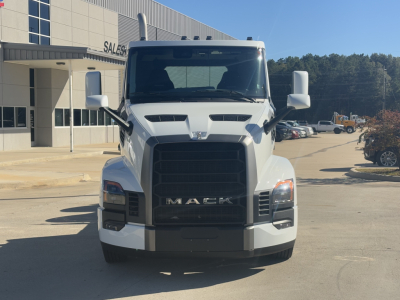 Front view of a white 2026 Mack PR64T truck showing large black grille with MAC K lettering, headlights, and side mirrors.
