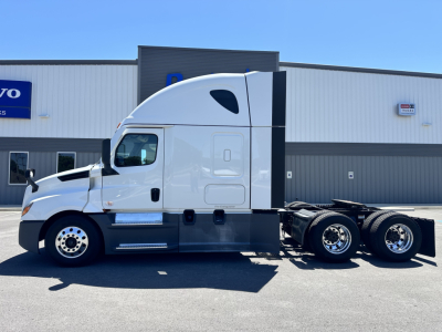 Freightliner Cascadia 126 truck in side profile showing sleeper cab, twin rear axles, fuel tanks, and wheel rims.